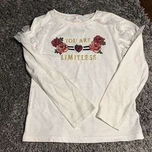 This is a long sleeve childrens shirt in a Size: 7